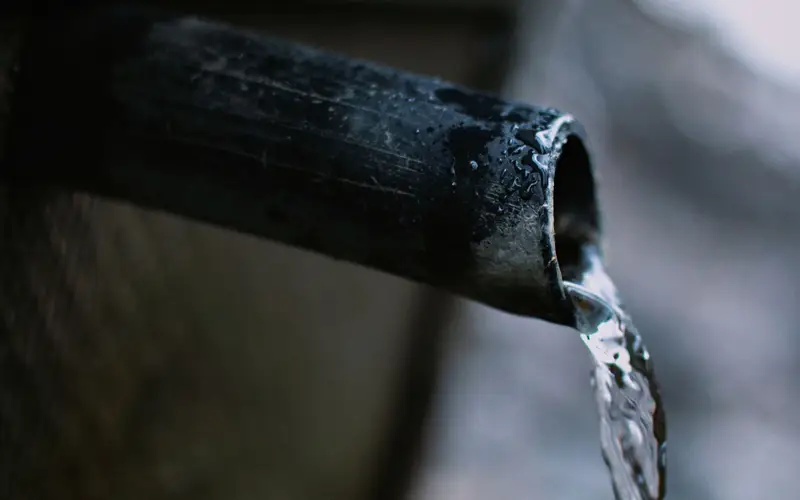 Water pouring from a broken pipe