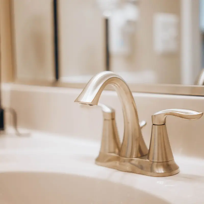New bathroom faucet installed by a plumber