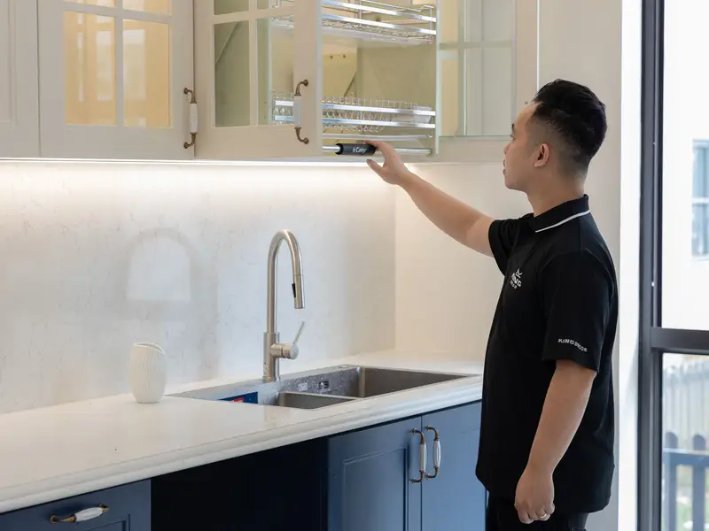 Plumber reviewing a written upfront quote with a homeowner